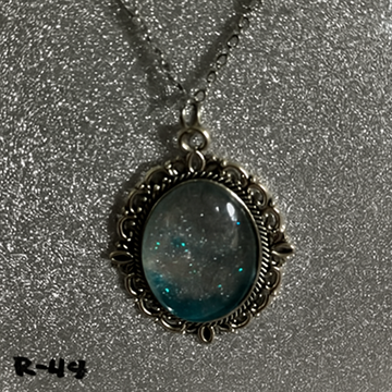 Glittering Silver Dust and Deep Aqua Resin Pendant in Ornate Setting R44