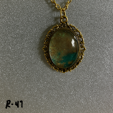 Glimmering Sand and Sea Resin Pendant in Antique Gold Frame R47
