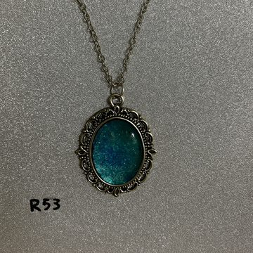 Sparkling Teal Lagoon Resin Pendant in Antique Silver Frame R53