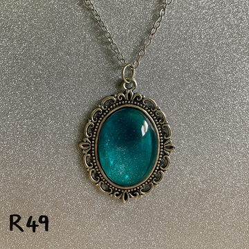 Glittering Frost and Teal Ocean Resin Pendant in Silver Filigree R49