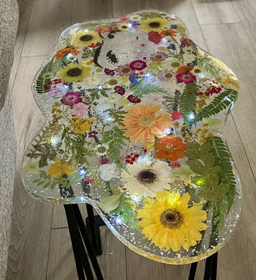 Lighted flower table with a contemporary lady's face