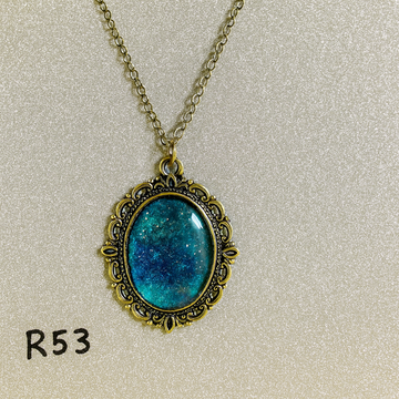 Sparkling Teal Lagoon Resin Pendant in Antique Silver Frame R53